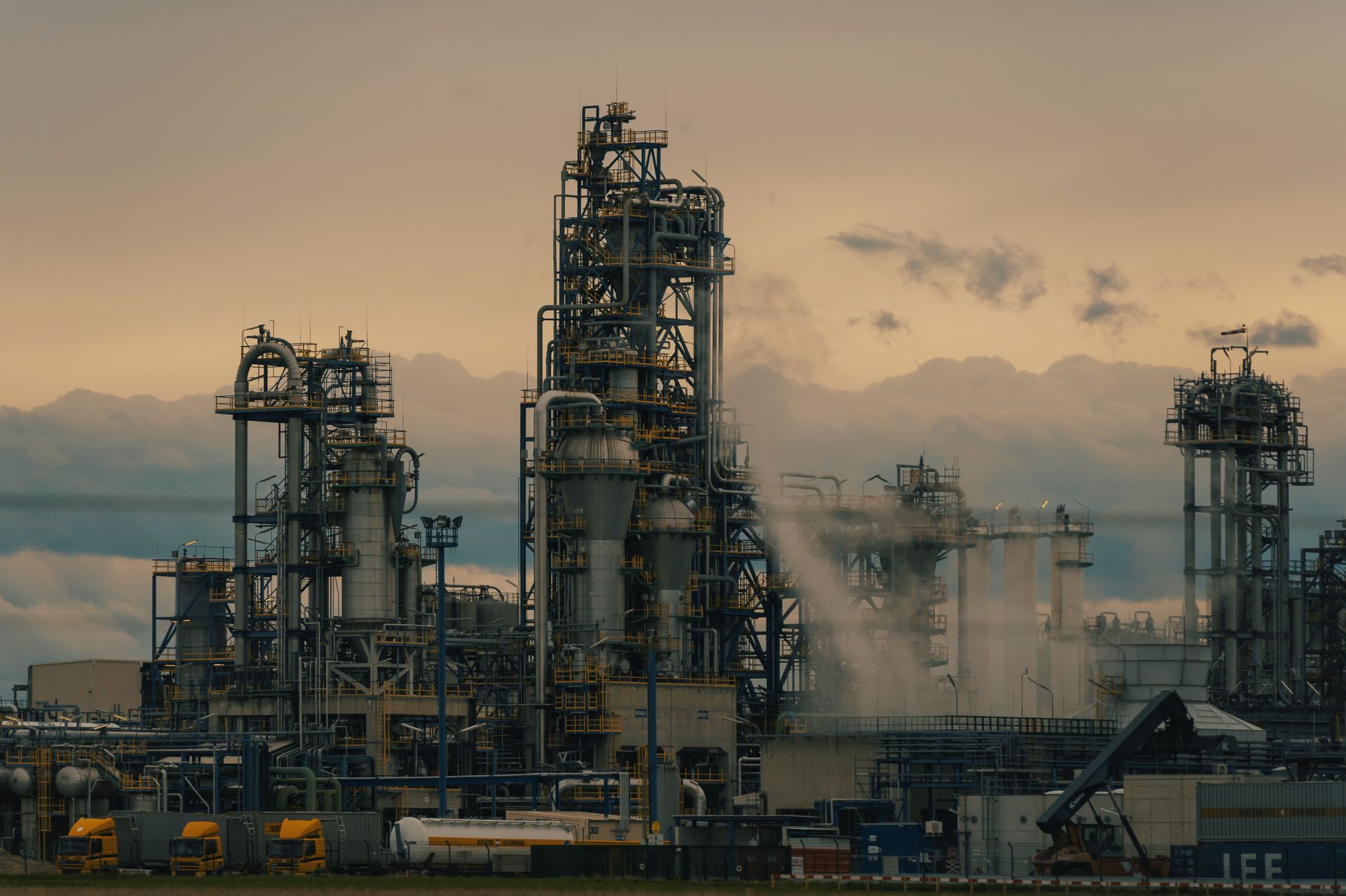 Oil refinery distillation columns at dusk — Commercial Aspects of Oil Refining