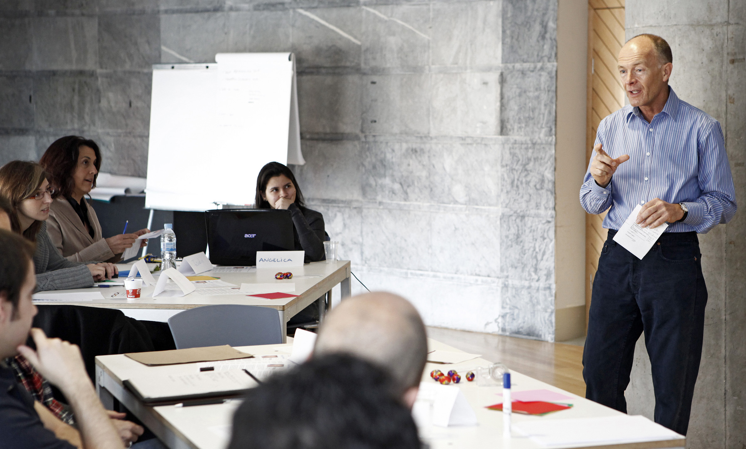 Expert trainer delivering petroleum project economics course to participants